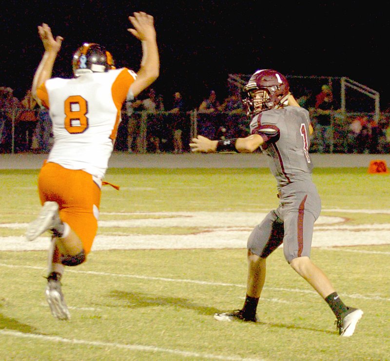 MARK HUMPHREY ENTERPRISE-LEADER Lincoln sophomore quarterback Sterling Morphis tries to get a pass off before Gravette sophomore linebacker Colton Grimes hits him. Morphis filled in for injured senior Harrison Swayne. Gravette defeated Lincoln, 33-0, Friday.