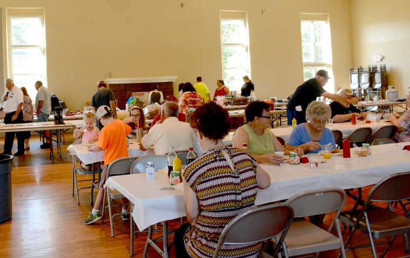 Michael Burchfiel/Herald-Leader Siloam Springs&#8217; American Legion and American Legion Auxiliary held a pancake breakfast fundraiser on Saturday. In addition to a meal, guests could bid on rows of items that were in a silent auction to benefit the veterans&#8217; organization.