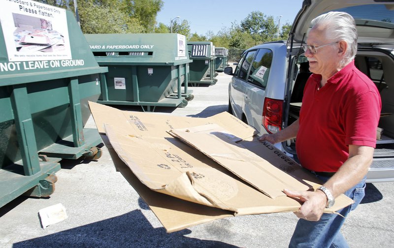 Ron Hagen of Fayetteville drops off cardboard Tuesday at the City of Fayetteville Recycling Drop Off Site on south Happy Hollow Road. The drop off is open 24 hours a day and seven days a week.