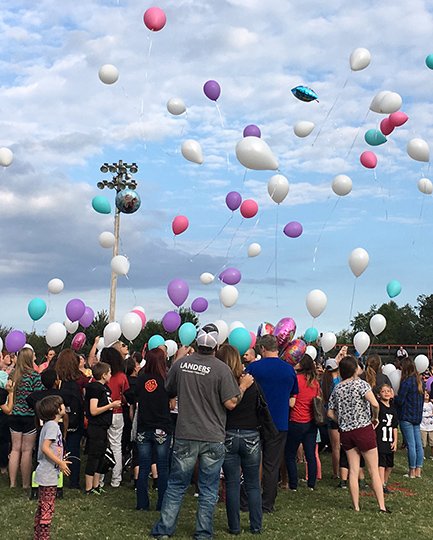Submitted photo IN MEMORY: Classmates, students, friends and family members release balloons prior to the kickoff of a peewee football game on the Cutter Morning Star campus Monday evening in memory of Kera Michelle Moreno, who was fatally injured in a car crash on Sept. 18. Photo courtesy of CMS Superintendent Nancy Anderson.