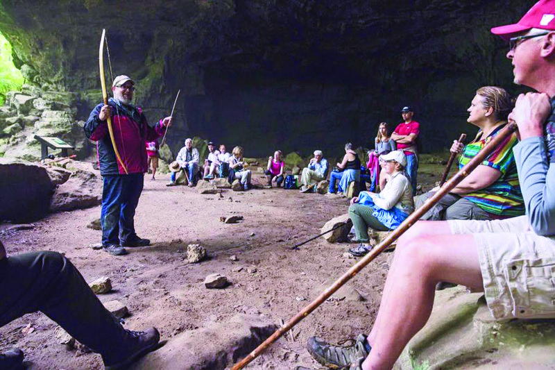 Call your bluff: Dr. Jamie Brandon talks about the bluff shelter research at Rockhouse Cave at Petit Jean State Park.