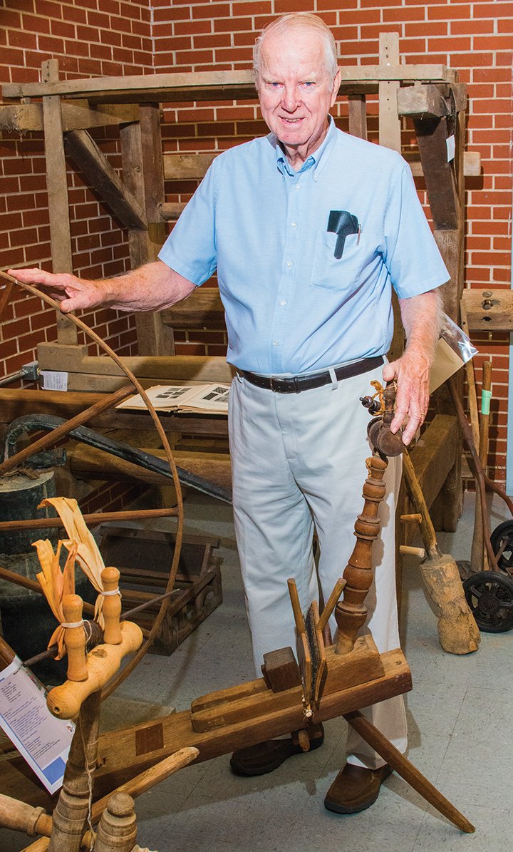 Charles Stuart, president of the Cleburne County Historical Society, discusses some of the pioneer tools that are on display in the society’s museum. The historical society moved into the old Heber Springs post office in March and set up this exhibit in an area that was once the loading dock for the post office.