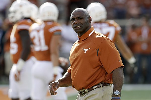 Texas head coach Charlie Strong watches his players warm up before a NCAA college football game, Saturday, Sept. 10, 2016, in Austin. (AP Photo/Eric Gay)

