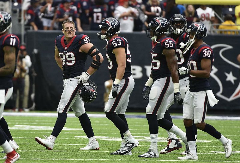 J.J. Watt (99), the Houston Texans’ defensive end, will miss a minimum of eight weeks with an injured back.
