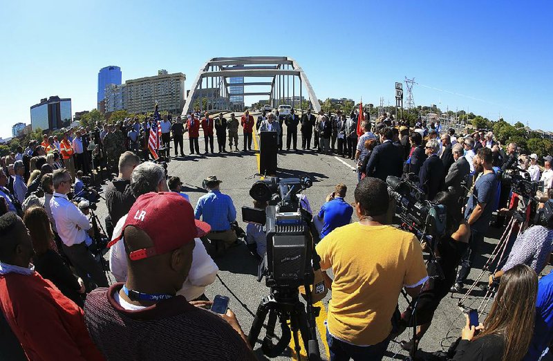 Arkansas Highway Commission Vice Chairman Tom Schueck speaks Wednesday morning during the closing ceremony for the Broadway Bridge. More photos are available at arkansasonline.com/galleries. 
