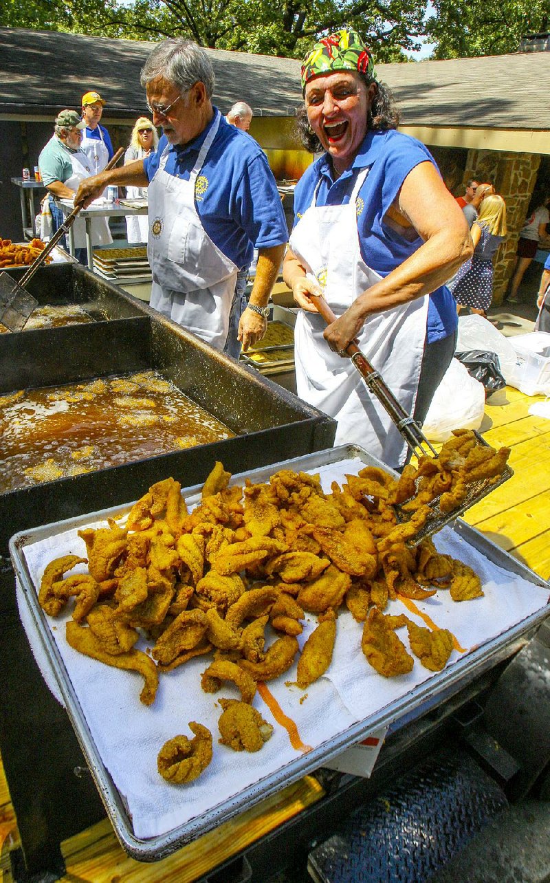 Members of the Little Rock Midtown Rotary Club will cook up more than 1,000 pounds of catfish for the annual Camp Aldersgate Fish Fry, taking place Sunday.