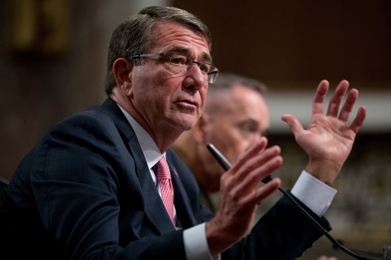 In this Sept. 22, 2016 file photo, Defense Secretary Ash Carter, accompanied by Joint Chiefs Chairman Gen. Joseph Dunford, testifies on Capitol Hill in Washington before the Senate Armed Services Committee hearing.
