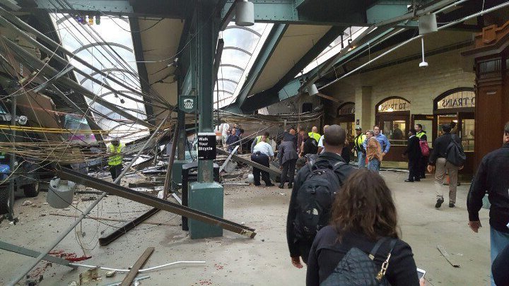 This photo provided by Ian Samuel shows the scene of a train crash in Hoboken, N.J., on Thursday, Sept. 29, 2016. A commuter train barreled into the New Jersey rail station during the Thursday morning rush hour, causing serious damage. The train came to a halt in a covered area between the station's indoor waiting area and the platform. A metal structure covering the area collapsed. ( Ian Samuel via AP)
