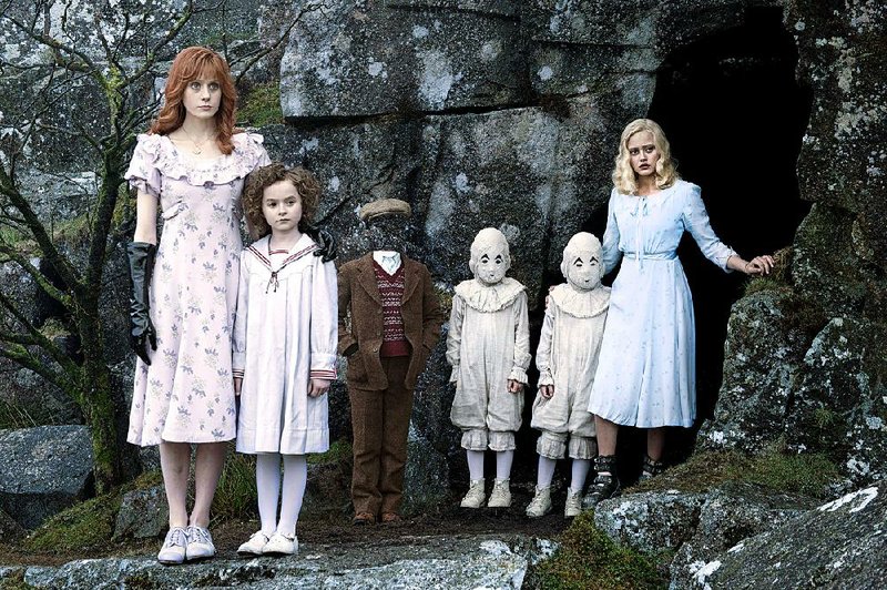 Pupils (from left) Bronwyn Bruntley (Pixie Davies), Olive Abroholos Elephanta (Lauren McCrostie), Millard Nullings (Cameron King), the “Masked Ballerinas” (twins Thomas and Joseph Odwell) and Emma Bloom (Ella Purnell) are all especially gifted in Tim Burton’s Miss Peregrine’s Home for Peculiar Children.
