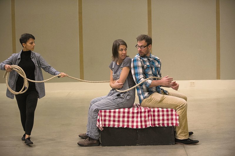 Justin Scheuer, right, as Delroy, Johnny Schremmer as Gilroy and Ren Pepitone, left, as The Charmer rehearse for the ArkansasStaged production of “Craving Gravy” by UA professor John Walch.