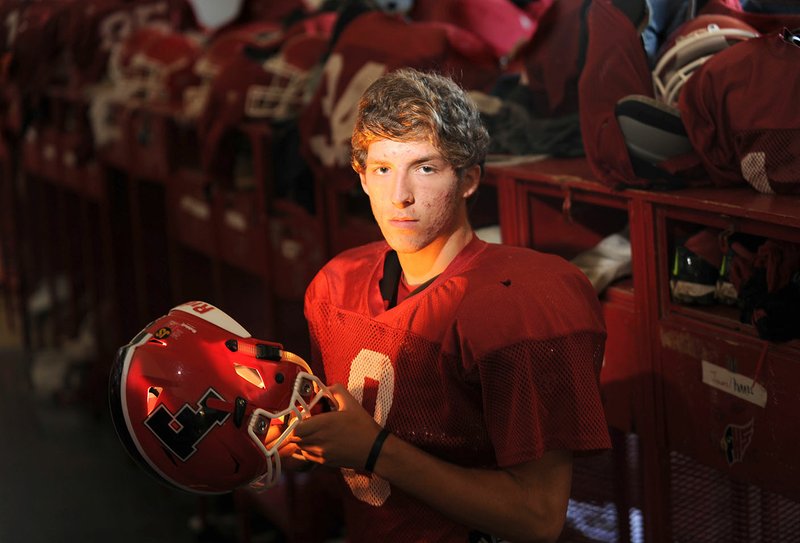 Farmington senior linebacker Jake Oskey, a two-year starter for the Cardinals, stands in the locker room Wednesday. He has recorded 21 tackles, one sack and an interception through four games this season.