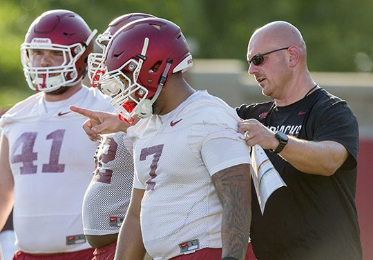 NWA Democrat-Gazette/Jason Ivester REGROUPING: Defensive-line coach Rory Segrest works with Razorback players during a preseason practice in Fayetteville. Stinging from a 45-24 loss to Texas A&M in its Southeastern Conference opener, Arkansas hopes to bounce back against Alcorn State this week in its only Little Rock appearance this season. Kickoff is 11 a.m. Saturday on the SEC Network alternate channel (Resort Channel 80).