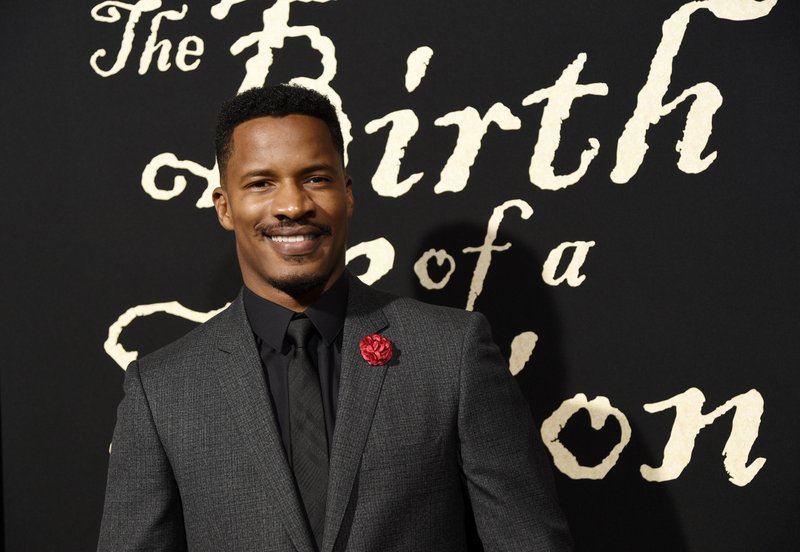 The Associated Press SORRY NOT SORRY: Nate Parker, the director, screenwriter and star of "The Birth of a Nation," poses at the premiere of the film on Sept. 21 in Los Angeles.