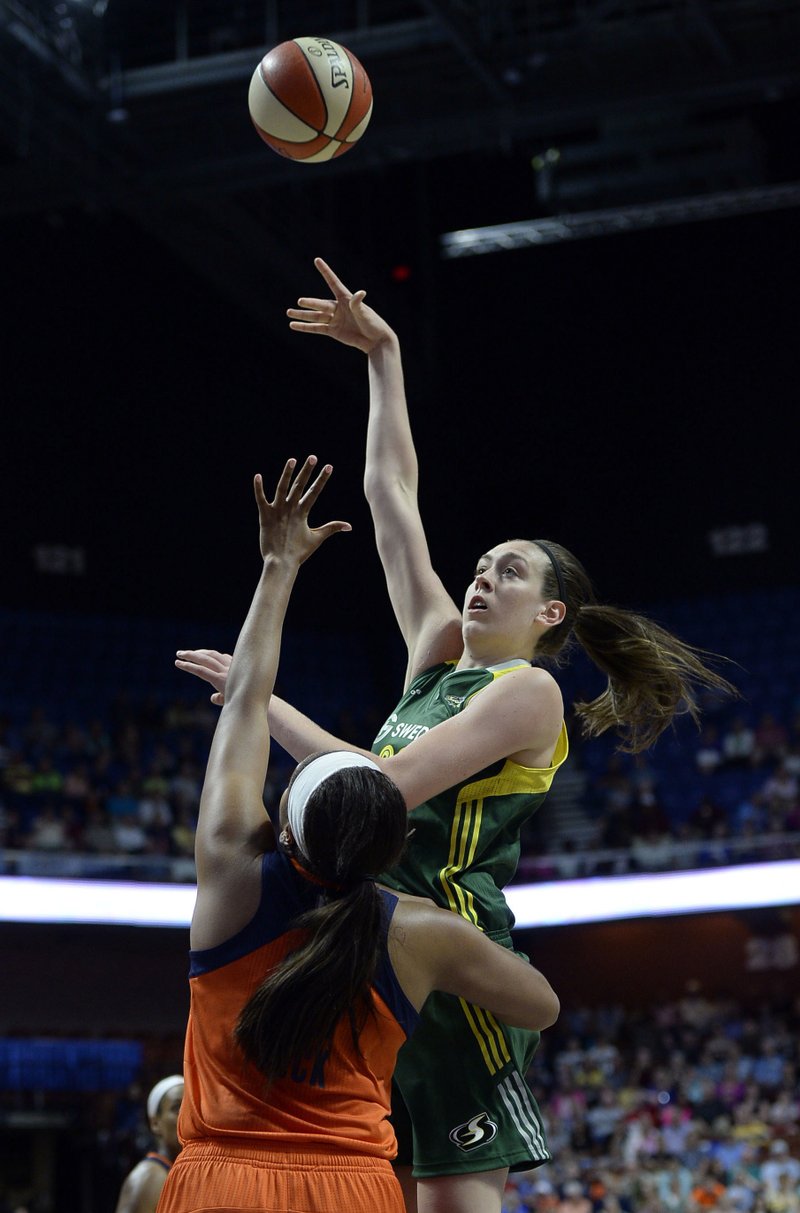 The Associated Press TAKING LEAGUE BY STORM: Seattle's Breanna Stewart, here shooting over Connecticut's Morgan Tuck in a June 10 game, is named WNBA rookie of the year. Stewart led the Storm to the playoffs after starring on four consecutive NCAA championship teams at the University of Connecticut.