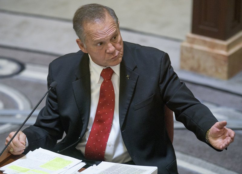 Alabama Chief Justice Roy Moore testifies during his ethics trial before the Alabama Court of the Judiciary at the Alabama Judicial Building in Montgomery, Ala., on Wednesday Sept. 28, 2016. He is accused of encouraging judges to defy the U.S. Supreme Court's ruling legalizing gay marriage. (Mickey Welsh/Montgomery Advertiser via AP, Pool)
