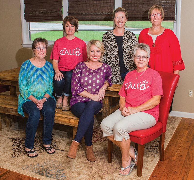 From left, Carol Balder, emergency-assistant-team coordinator and data processor; Felicia Stone, family support coordinator; Ashley Herring, Cleburne County coordinator; Valerie Griesse, events coordinator; Vangie Stone, volunteer coordinator and church representative; and Alyce Chapin, ministry house manager, gather at the conference table at The CALL in Cleburne County’s facility in Heber Springs. The CALL trains area families to become foster parents.