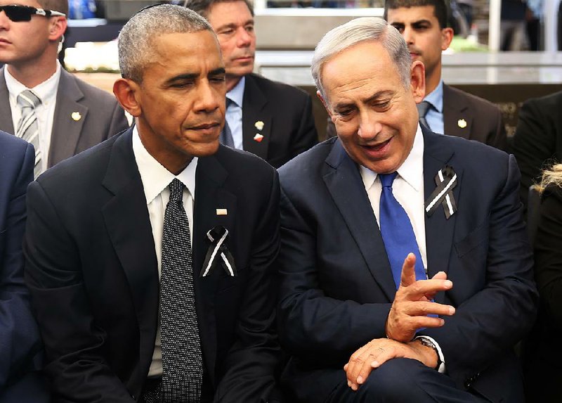 Israeli Prime Minister Benjamin Netanyahu talks with President Barack Obama at Jerusalem’s Mount Herzl national cemetery during the funeral Friday for former Israeli President Shimon Peres.