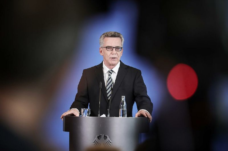 German Interior Minister Thomas de Maiziere talks Friday in Berlin about the number of migrants Germany took in last year, saying the paperwork is still incomplete.