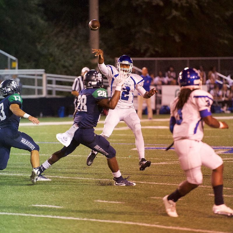 Sylvan Hills quarterback Jordan Washington (center) tosses a pass over the top of a Little Rock Christian defender in Friday night’s game. Washington accounted for 265 yards of total offense and three touchdowns to carry the Bears to a 42-35 victory.