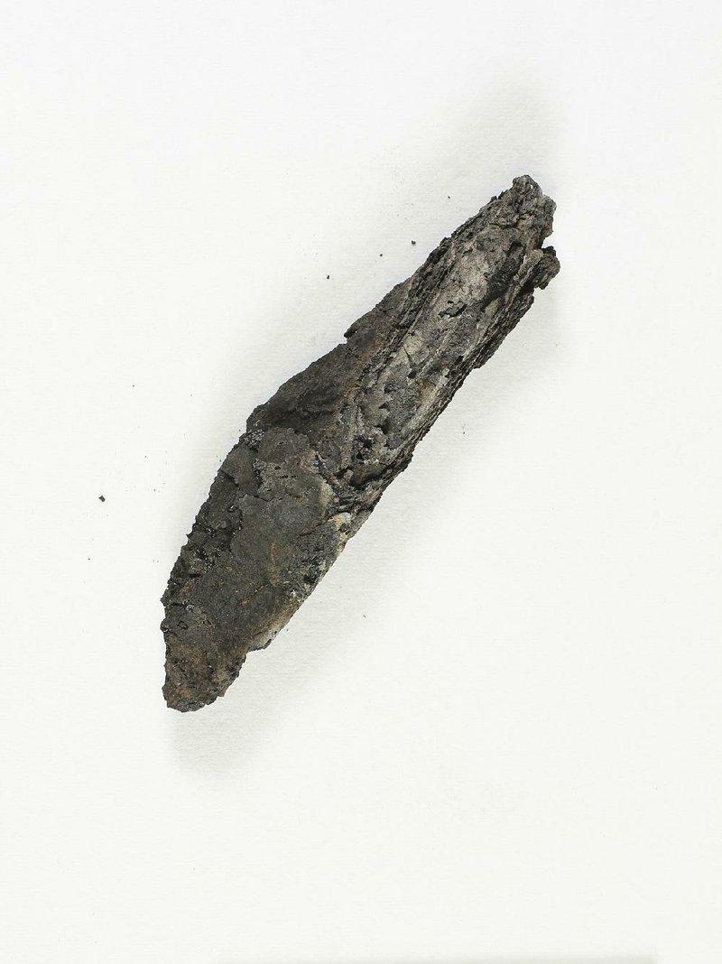 This ancient charred scroll, destroyed in a fi re centuries ago, was subjected to 3-D analysis, allowing experts to read the text without physically opening the damaged document. 