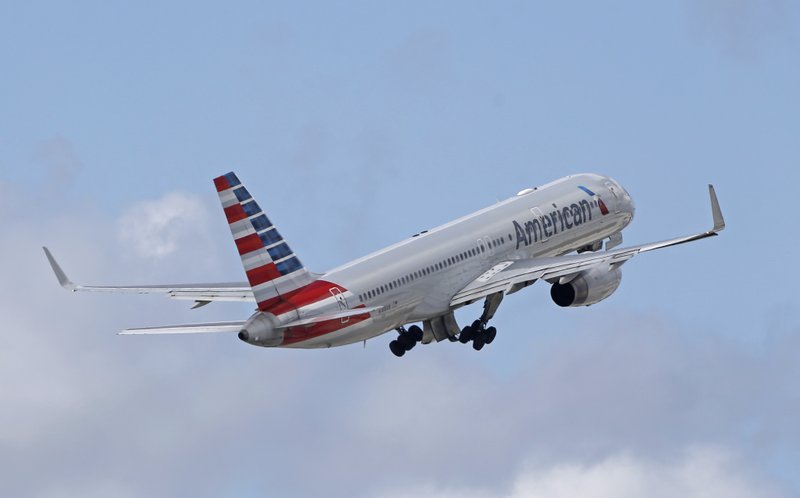 In this Friday, June 3, 2016, photo, an American Airlines passenger jet takes off from Miami International Airport in Miami. 