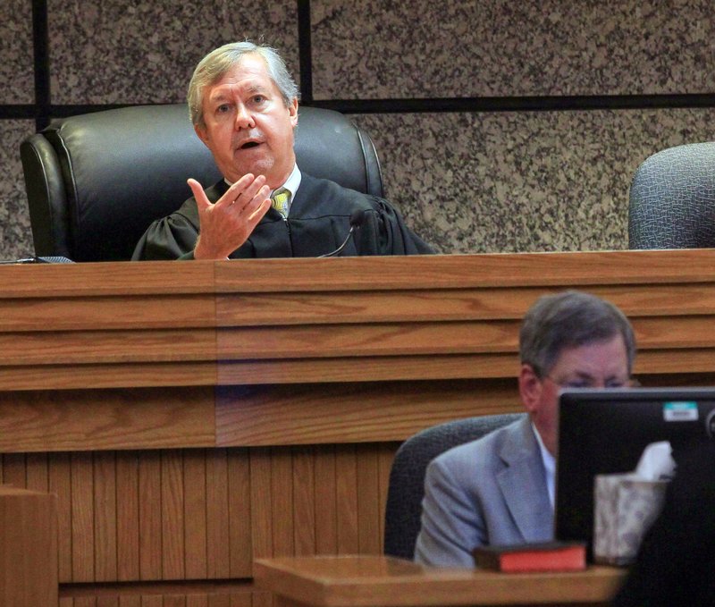 Judge Edgar Long presides over a hearing of a 14-year old, who was charged as a juvenile Friday, Sept. 30, 2016 in Anderson, S.C., with murder and three counts of attempted murder after authorities say he killed his father and opened fire on students at a playground, wounding three people. The Associated Press typically does not identify juveniles charged with crimes. Authorities have not released a motive for the school shooting or killing.  (Ken Ruinard /The Independent-Mail via AP, Pool)