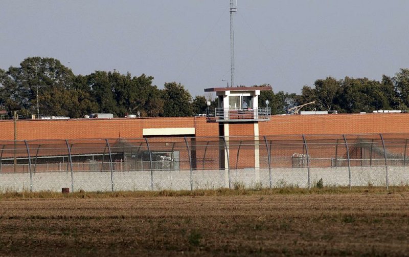 An Arkansas Department of Correction guard can be seen in a tower at the Delta Regional Unit in Dermott in this Saturday, Oct. 1, 2016, file photo.