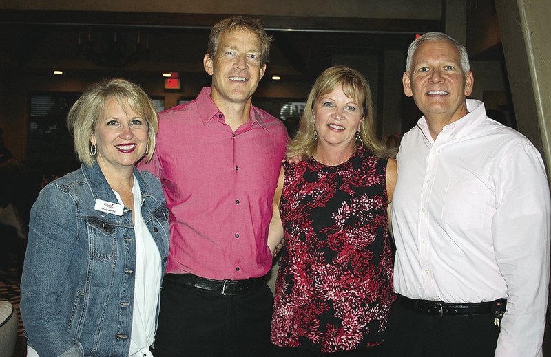 Mary Zettle (from left), Brandon and Kari Nikolish and Mike Turner attend the Swing for the Cure pre-party.