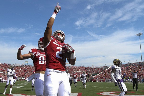 Arkansas running back Devwah Whaley points to the sky after scoring a touchdown during a game against Alcorn State on Saturday, Oct. 1, 2016, at War Memorial Stadium in Little Rock. 