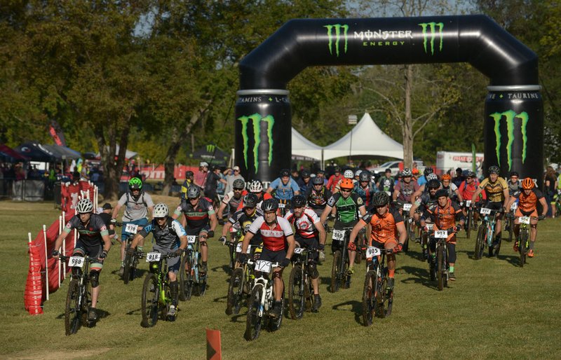 A group of riders start their category 3 race Sunday during the annual Slaughter Pen Jam at the Slaughter Pen trails in Bentonville. Sunday concluded the three-day festival with cross country races that were part of the Monster Energy Arkansas Mountain Bike Championship Series.