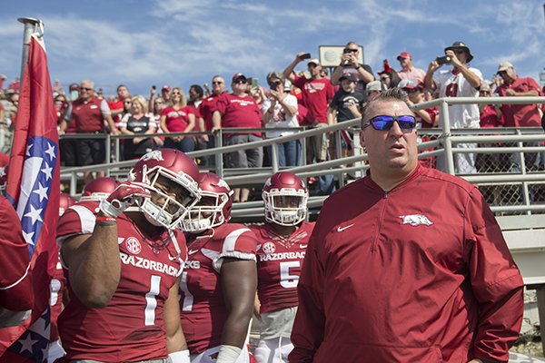 Arkansas coach Bret Bielema prepares to run onto the field with his team prior to a game against Alcorn State on Saturday, Oct. 1, 2016, at War Memorial Stadium in Little Rock. 