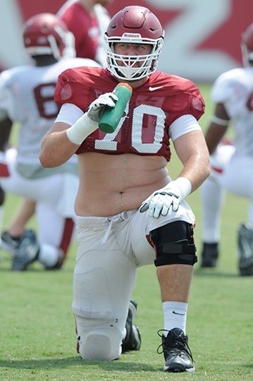 NWA Democrat-Gazette/Michael Woods DAN'S THE MAN: Arkansas senior left offensive tackle Dan Skipper, pictured relaxing during a preseason practice, receives his second weekly honor of the season from the Southeastern Conference Monday. Skipper was named the league's outstanding special-teams player for blocking a field goal in Arkansas' 52-10 Little Rock victory Saturday over Alcorn State. The 6-10 player was named the league's top offensive lineman for his performance against TCU in a double-overtime Razorback victory Sept. 10. Arkansas, ranked No. 16 nationally, faces No. 1 Alabama at 6 p.m. Saturday in Fayetteville on ESPN.