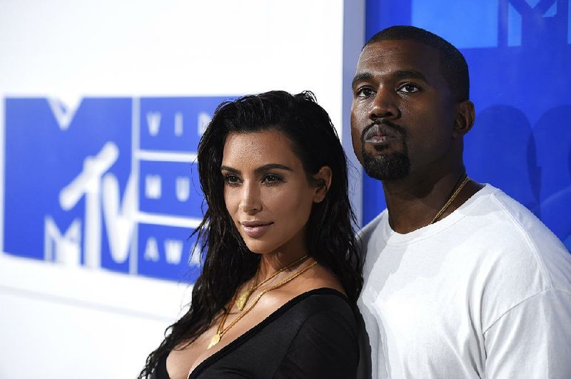 In this Aug. 28, 2016 file photo, Kim Kardashian West, left, and Kanye West arrive at the MTV Video Music Awards in New York. 