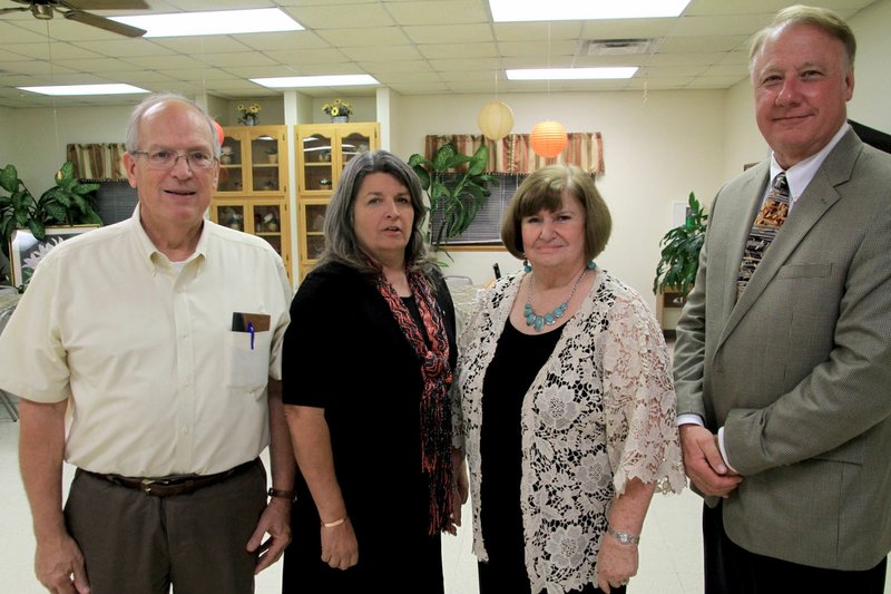 Photo by Steve Huckriede New officers for the Gravette Kiwanis Club were installed at the club&#8217;s annual banquet Thursday, Sept. 22, at the Billy V. Hall Senior Activity Center. Dan Yates, lieutenant governor of Mo-Ark Kiwanis District, installed Malcolm Winters, left, treasurer; Brenda Yates, secretary; and Lavon Stark, president, shown here with outgoing president Richard Page. President-elect Jay Chalk was unable to attend.