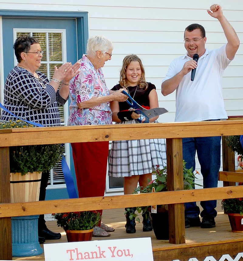 Janelle Jessen/Herald-Leader Kind at Heart Ministries held a ribbon cutting for Vivian Stockton&#8217;s new apartment on Saturday morning. Pictured are Mary Thomas, Stockton, Stockton&#8217;s foster granddauther Destiny, and Pastor Wayne Thomas.