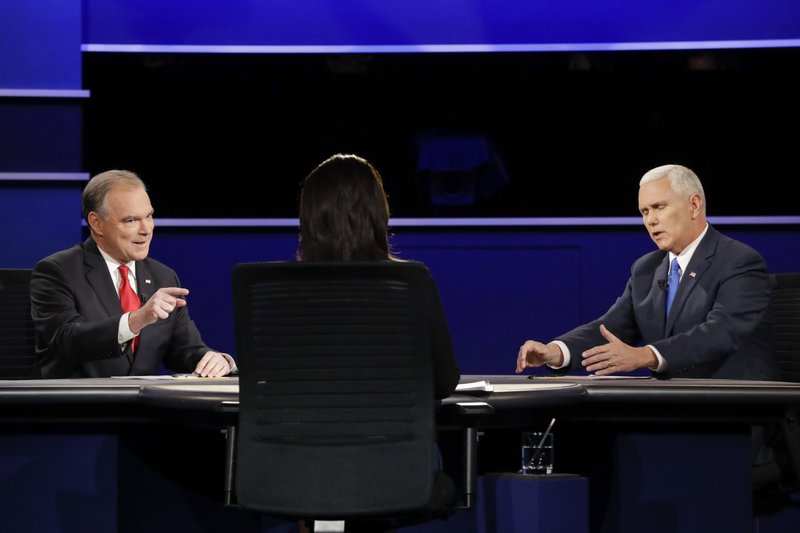 Republican vice-presidential nominee Gov. Mike Pence, right, and Democratic vice-presidential nominee Sen. Tim Kaine discuss a question during the vice-presidential debate at Longwood University in Farmville, Va., Tuesday, Oct. 4, 2016. (AP Photo/David Goldman)
