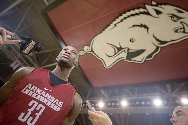 Arkansas senior Moses Kingsley answers questions Wednesday, Oct. 5, 2016, at Bud Walton Arena in Fayetteville. 