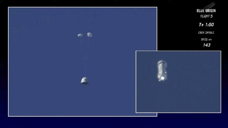 This image from video provided by Blue Origin shows the New Shepard capsule (left) returning to the ground Wednesday in west Texas as the booster rocket (right) continues upward during a test of the capsule escape system. 