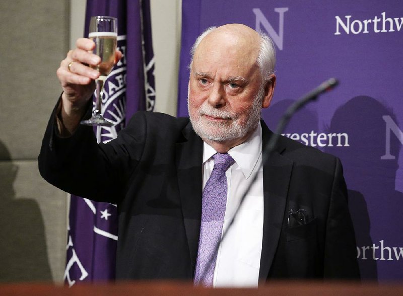 Fraser Stoddart toasts Wednesday at Northwestern University in Evanston, Ill., after he was one of three scientists awarded the Nobel Prize in chemistry.