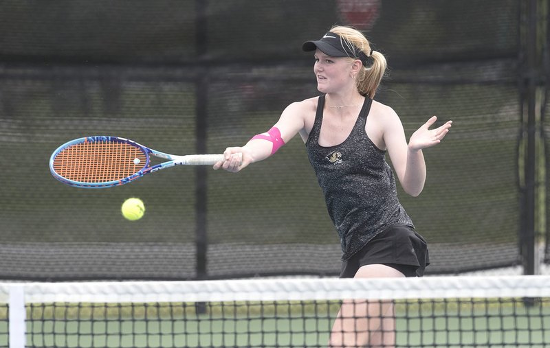 Bentonville’s Brooke Killingsworth follows through on a forehand return Oct. 5 at the 7A-West Tennis Tournament in Bentonville.