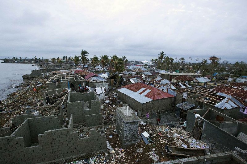 The devastation from Hurricane Matthew is widespread in Les Cayes, Haiti, in the photo above taken during a helicopter tour of the damage Thursday, two days after the storm lashed the country’s remote southwestern peninsula. Haitian officials raised the death toll as searchers accessed hardhit areas. “Devastation is everywhere,” said Pilus Enor, mayor of the town of Camp Perrin. In many communities, people faced an immediate hunger crisis, and clean water was scarce for many.