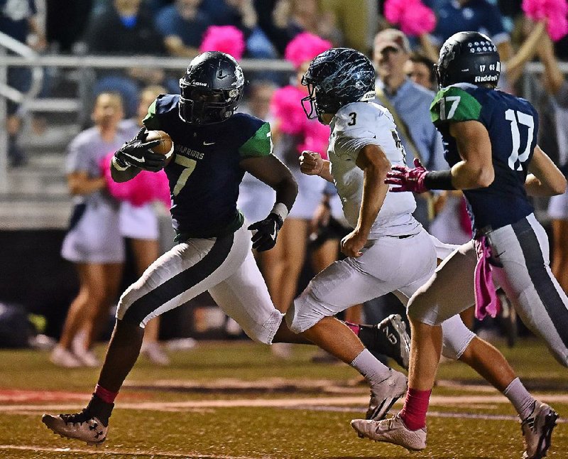 Little Rock Christian’s Drake Bradley (left) tries to run past Pulaski Academy quarterback Layne Hatcher (3) as he attempts to score on a fumble recovery during the Warriors’ 73-35 loss to the Bruins on Friday.