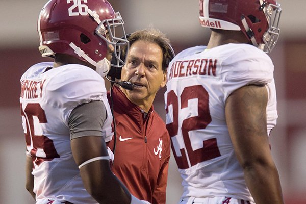 Alabama coach Nick Saban talks to defensive back Marlon Humphrey during a game Saturday, Oct. 8, 2016, in Fayetteville. 