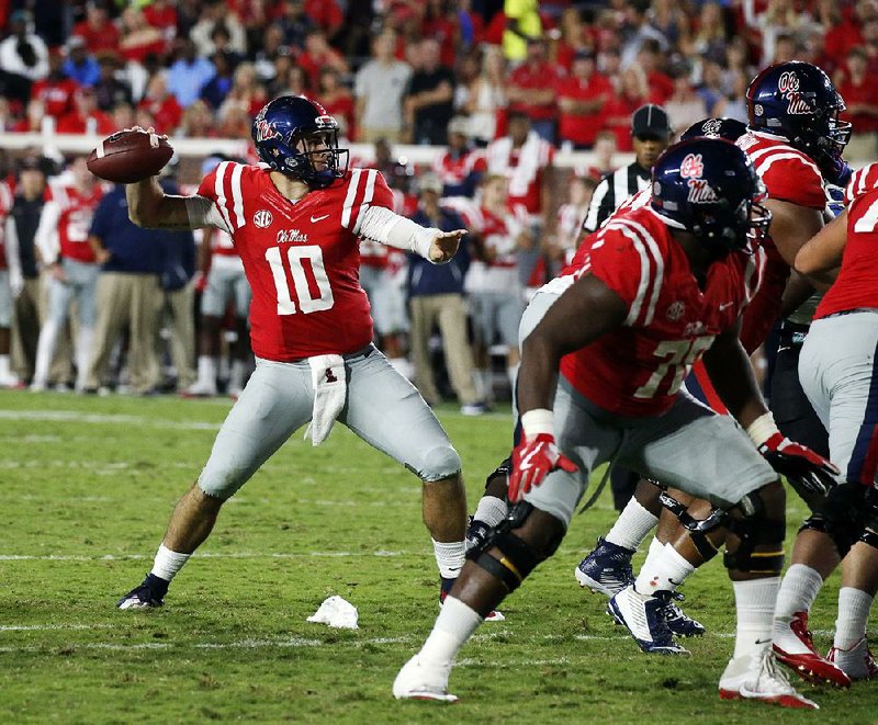 Ole Miss quarterback Chad Kelly had to be restrained after he ran onto the field of a high school game in Buffalo, N.Y., to defend his brother Casey Kelly, who reportedly took a late hit. The game was suspended by police after the altercation.