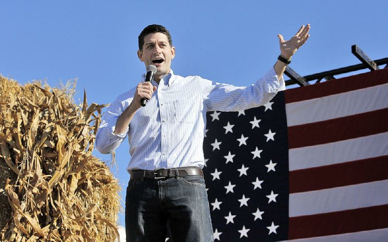 House Speaker Paul Ryan speaks at a rally Saturday in Elkhorn, Wis., drawing boos as he spoke about how he withdrew his invitation to Donald Trump to speak at the event. 