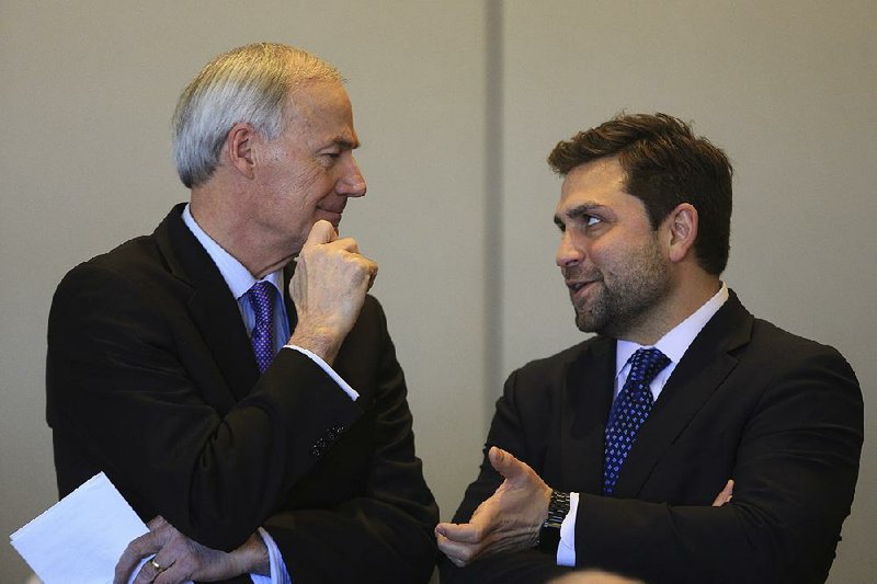 Gov. Asa Hutchinson (left) talks with Senate President Jonathan Dismang, R-Searcy, in this file photo.