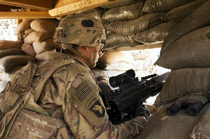 A U.S. Army soldier keeps watch at Camp Swift, northern Iraq, last month.