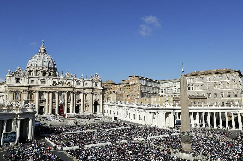 People gather in St. Peter’s Square at the Vatican as Pope Francis celebrates a jubilee Mass on Sunday.