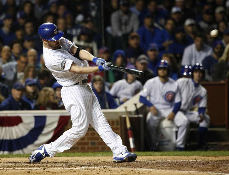 Chicago Cubs' Travis Wood (37) hits a home run in the fourth inning of Game 2 of baseball's National League Division Series against the San Francisco Giants, Saturday, Oct. 8, 2016, in Chicago. (AP Photo/Nam Y. Huh)