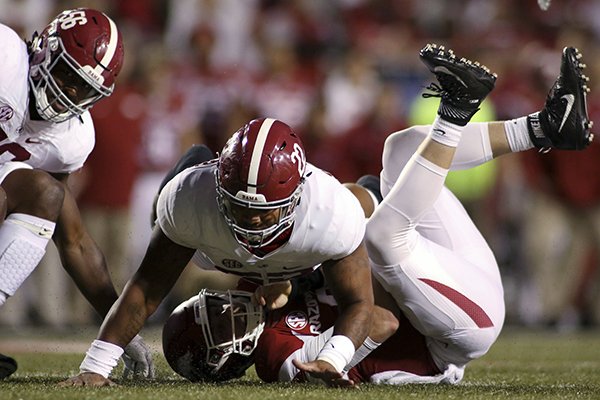 Alabama's Ryan Anderson (22) falls on top of Arkansas' Austin Allen, who was sacked by Alabama's Tim Williams (56) during the second quarter of an NCAA college football game Saturday, Oct. 8, 2016, in Fayetteville, Ark. (AP Photo/Samantha Baker)

